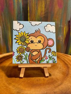 a painting of a monkey with sunflowers on a wooden stand in front of a colorful background