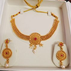 Title: "Timeless Splendor: Temple Gold Plated Jewelry Set" Step into the realm of timeless elegance with our Temple Gold Plated Jewelry Set, a majestic ensemble that encapsulates the essence of South Indian heritage. Crafted with meticulous attention to detail, this set is more than just jewelry; it's a symbol of tradition and grace, making it an ideal gift for any cherished occasion. Indulge in the opulence of our gold-plated necklace, intricately adorned with traditional South Indian motifs an Antique Round Pearl Necklace For Wedding, Handmade Gold Bridal Necklace, Handmade Gold Round Bridal Necklace, Gift Temple Jewelry Necklace, Gift Round Temple Jewelry Necklace, Handmade Round Gold Bridal Necklace, Gold Round Pearl Necklace For Festivals, Intricate Design Pearl Necklace As Festival Gift, Festival Gift Pearl Necklace With Intricate Design