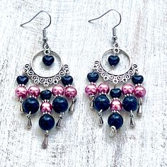 Shop our Black Stone & Pink Glass Pearl Chandelier Earrings for a touch of elegance. Perfect for any occasion, these high-quality earrings feature a unique chandelier design and versatile black and pink colors. Invest in a timeless piece for your jewelry collection today. Black Metal Dangle Chandelier Earrings, Elegant Black Chandelier Earrings With Dangling Beads, Black Party Chandelier Earrings With Dangling Beads, Elegant Pink Jewelry With Black Beads, Black Chandelier Drop Earrings With Ear Wire, Black Dangle Chandelier Earrings For Party, Black Chandelier Earrings For Party, Elegant Pink Chandelier Earrings With Dangling Beads, Elegant Pink Metal Beaded Earrings