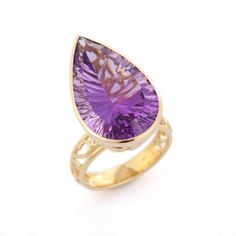 Amethyst Cocktail Ring in 14K Gold is a perfect statement jewelry to match with every outfit of your wardrobe. It's just a simple ring and simplicity is the ultimate form of sophistication.  Amethyst encourages self-control and strengthens the bond in a relationship  PRODUCT DETAILS :-  > Material - 14K Solid Yellow Gold > Gemstone - Amethyst  > Gemstone Weight - 18.2 ct > Gemstone pcs - 1 > Gemstone shape - Pear  > Gemstone size - 25 x 15 mm > Gross Weight - 9.428 Grm > Shank width - 4.05 mm > Elegant Teardrop Amethyst Ring, Formal Amethyst Pear-shaped Ring, Elegant Teardrop Amethyst Gemstone Ring, Formal Teardrop Amethyst Ring In Fine Jewelry Style, Elegant Teardrop Amethyst Ring For Formal Occasions, Elegant Teardrop Purple Amethyst Ring, Elegant Purple Teardrop Amethyst Ring, Teardrop Amethyst Ring For Formal Occasions, Elegant Pear-shaped Purple Amethyst Ring