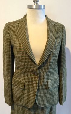 Classic, sharp and elegant....vintage woman suitBurberrys made in Englandin brown/green plaid Shetland tweed ....great fall colorsjacket features peak lapels and one-button front and 3 at cuff, full lining, fitted form, side pockets and small pocket at chest for scarf (note; that the suit has been clean but has some stains as you can see in pics), option to be creative with this AS IS. The skirt is mid calf, overlapping split at front, high waist, zipper w/hooks on side for closure, fully lined. Fitted Plaid Tweed Wool Jacket, Plaid Wool Tweed Jacket For Office, Fall Fitted Tweed Jacket, Green Fitted Tweed Jacket For Fall, Fitted Green Tweed Jacket For Fall, Plaid Single-breasted Tweed Jacket, Fitted Plaid Tweed Jacket Single Breasted, Tailored Green Tweed Jacket For Fall, Green Tweed Jacket For Fall Workwear