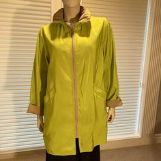 New, Never Worn, This Packable Raincoat Is Perfect For Traveling Or Anytime You Lightweight And Stylish Protection From Wind Or Rain. The Coat Is Completely Reversible With Pockets On Each Side. The Matching Travel Bag Makes It Easy To Pack Or Carry The Boat With You. Full Length Zipper In Front, Hood Packs Neatly Into Collar Without Additional Bulk. Washable, Made In Usa. Received As A Gift And Never Worn; New, No Tags. Fashionable And Convenient. Length = 30”, Collar = 4”, Armpit To Armpit =22 Reversible Hooded Fall Outerwear, Casual Green Spring Raincoat, Spring Green Nylon Raincoat, Green Double-lined Hood Outerwear For Spring, Green Travel Outerwear With Pockets, Hooded Outerwear With Double-lined Hood For Layering, Spring Travel Windbreaker In Green, Green Spring Outerwear For Layering, Casual Green Travel Raincoat