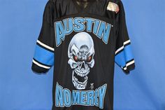 a hockey jersey with an image of a skull on the front and words,'austin nomerry '