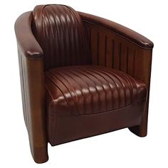 a brown leather chair sitting on top of a white floor