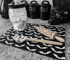 a kitchen counter with a skull and a rolling pin on top of the countertop