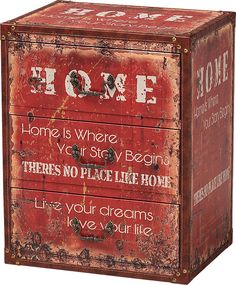 an old red metal box with the words home written on it and some writing below