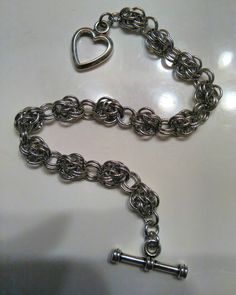 "Measures 7 \" in length with antiqued silver plated heart toggle clasp. Can customize length. Comes Gift boxed *Custom Orders Welcome*" Silver Heart Chain Bracelet In Metal, Silver Metal Heart Bracelet With Chain, Silver Heart Bracelet With Chain, Silver Metal Chain Bracelet For Valentine's Day, Valentine's Day Silver Metal Chain Bracelet, Metal Heart Bracelet With Toggle Clasp As Gift, Metal Heart Bracelet With Toggle Clasp, Handmade Metal Heart Charm Bracelet, Nickel Free Silver Metal Heart Bracelet