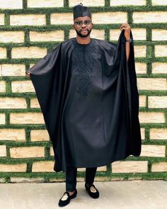 Authentic African AGBADA for men. Do you love wearing fashionable African outfits made of high quality fabrics with top notch tailoring? If yes, kindly place your orders for this Original AGBADA. We do for individuals, groups, couples and even families and cater to both males and females. All outfits are made to order for exact fit per customer wishes. This particular AGBADA comes in Black color which makes it really beautiful. The design is available in several colors so you can tell us your pr Ebuka Style, Agbada For Men, Suit Prom, African Luxury, Groom's Suit, Latest Aso Ebi Styles, African Outfits, Wedding Suits Groom, Aso Ebi Styles