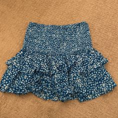 This Is A Perfect Skirt For The Beach Or For A Cute Brunch! Never Worn And Great Material! Blue Stretch Ruffle Skort, Blue Ruffled Stretch Skort, Blue Ruffled Skort For Beach, Stretch Mini Skirt For Vacation, Casual Stretch Mini Skirt For Brunch, Blue Mini Skirt With Elastic Waistband For Beach, Blue Elastic Waistband Mini Skirt For Beach, Blue Flowy Skirt For Vacation, Stretch Tiered Mini Skirt For Beach