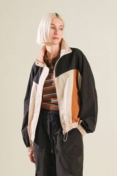 A woven color block windbreaker Details: Self: 100% NylonContrast 1: 100% NylonContrast 2: 100% Nylon Size & Fit - Model is 5`8" And Wearing Size Small- Measurements Taken From Size Small- Approx. Length: 24" Cheap Retro Windbreaker For Sports, Outerwear With Contrast Color For Spring Outdoor, Contrast Color Outerwear For Outdoor Spring Activities, Contrast Color Outerwear For Outdoor In Spring, Fall Outerwear With Contrast Color For Outdoor, Fall Outdoor Outerwear With Contrast Color, Black Track Jacket With Contrast Color For Fall, Spring Windbreaker With Contrast Color And Long Sleeves, Casual Beige Track Jacket For Fall