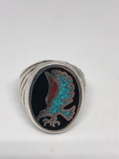 Cool Vintage Rock and Roll star men's ring Genuine stone Southwestern inlay Nice heavy ring, Silver white bronze Does not tarnish Unused stock from the 1980's I have an assortment of sizes from 7, 8-14 We have some half sizes. My jeweler can custom resize for $10-$20 fee Please add your size to the order in a message and I will send the size you require. If I am out of stock in your size, I will list the ones I have available for replacement. If I am sold out in the sizes you would prefer, I wil Artisan Silver Turquoise Ring With Inlay, Traditional Silver Turquoise Ring With Inlay, Sterling Silver Inlay Jewelry, Native American Style, Real Turquoise, Coral Stone, Stone Inlay, Vintage Rock, Native American Fashion