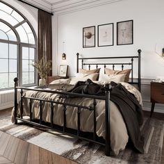 a bedroom with a large bed and lots of windows