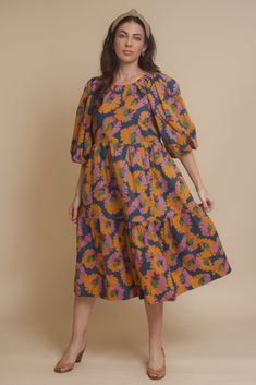 Brand: Moodie Puff sleeve midi dress with vibrant floral print. Dress has side pockets and an open back with tie. ♡ Details Color: Multi Puff sleeves Hidden side pockets Open tie back Partially lined 100% Cotton | Lining; 70% Polyester, 30% Cotton Hand wash recommended Sizing Model info: Height 5'3"| Bust 32D| Waist 25"| Hips 34" Model is wearing a size XS Fit: Relaxed fit Stretch: No stretch Measurements: XS: Bust = 35" | Waist = 34" | Length = 42.5" S: Bust = 36" | Waist = 35" | Length = 42.5" Floral Print Midi Puff Sleeve Dress For Garden Party, Garden Party Floral Print Midi Puff Sleeve Dress, Floral Print Puff Sleeve Midi Dress, Puff Sleeve Midi Dress With Floral Print For Brunch, Puff Sleeve Floral Midi Dress For Brunch, Brunch Floral Print Midi Dress With Puff Sleeves, Multicolor Floral Print Dress With Balloon Sleeves, Midi Length Dresses With Pockets For Brunch, Multicolor Balloon Sleeve Dress For Brunch