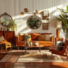 a living room filled with furniture and lots of plants