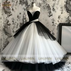 Black Fitted Tulle Wedding Dress, Fitted Black Tulle Wedding Dress, Black Tulle Ball Gown For Wedding, Black Tulle Skirt Ball Gown For Wedding, Sleeveless Black Ball Gown For Wedding, Fitted Black Ball Gown For Wedding, Black Sweetheart Neckline Ball Gown For Wedding, Black Floor-length Ball Gown For Quinceanera, White Tulle Ball Gown For Banquet