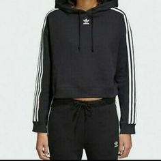 Adidas Originals Women's Cropped Hoodie Size Medium Brand New With Tag Casual Adidas Hoodie With Three Stripes, Adidas Three Stripes Hoodie For Fall, Adidas Hoodie With Three Stripes For Fall, Sporty Black Hoodie With Three Stripes, Black Three Stripes Hoodie For Streetwear, Black Hoodie With Three Stripes For Streetwear, Hooded Sweatshirt With Three Stripes Branding For Spring, Hooded Sweatshirt With Three Stripes For Spring, Casual Spring Hoodie With Three Stripes Branding