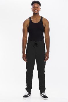 Solid jogger w/ elastic drawstring waist and zippered pocket 55% cotton, 45% polyester, 5% spandex Spring Sweatpants With Functional Drawstring And Relaxed Fit, Sporty Spring Cargo Pants With Drawstring, Sporty Spring Cargo Pants With Functional Drawstring, Athleisure Sweatpants With Elastic Waistband For Streetwear, Urban Activewear With Elastic Waistband For Loungewear, Casual Joggers With Elastic Waistband For Streetwear, Stretch Sweatpants With Drawstring, Stretch Sweatpants With Drawstring In Sportswear Style, Stretch Sweatpants With Drawstring For Sportswear