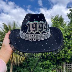 Black Cowboy hat embellished with rhinestones Personalised for a big birthday celebration  Cowboy hat has chin strap to tie firmly on These hats have an approx circumference of 59cm If you have any questions about personalisation do not hesitate to send me a message Festival Hats With Rhinestones And High Crown, Festival Hat With Rhinestones And High Crown, Embellished Party Cap, Embellished High Crown Hats For Party, Party Hats With Rhinestones And Curved Brim, Festival Fedora Hats With Rhinestones, Western Party Hat With Rhinestone Fringe, Western Style Party Hats With Rhinestones, Costume Hat With Rhinestones For Festivals