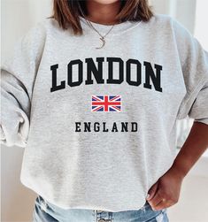 "London Sweatshirt, London England Shirt, London UK Gift, Cute London Sweater, English Souvenirs, College Style Premium Unisex Crewneck How to Order 1* View all color and size charts before you place your order. 2* Select your shirt \"SIZE\" and \"COLOR\". 3* Click add to cart.  If you are ordering more than 1 item, you need to repeat this process for each item you wish to order. Product Information 8 oz.(US) 13.3 oz.(CA), 50/50 preshrunk cotton/polyester Heather Sport colors: 60/40 polyester/co London Sweatshirt, Hoodie Design Ideas, England Shirt, Sweat Gris, London Souvenirs, Style Sweatshirt, College Style, Winter Hoodies, Uk Gifts