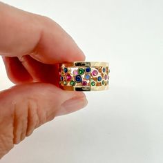 Introducing the exquisite Multi Color Eternity Thick Band in 14K Yellow Gold—a true masterpiece that effortlessly combines luxury, craftsmanship, and captivating aesthetics. Handcrafted in the heart of Italy, this wide band ring is a symbol of timeless beauty and sophistication.14K Yellow Gold 9.3mm thick Multi color zirconia Size 4.5 / 5.5 Thank you for visiting our shop!Visit our website DmKJewelry.comAlso Follow us on Instagram https://www.instagram.com/dmkjewelry_/ Elegant Multi-stone Wide Band Rings, Diamond Thick Band Jewelry As Gift, Fine Jewelry Gemstone Ring With Wide Band, Elegant Multicolor Rings With Bezel Setting, Yellow Gold Rings With Bezel Setting And Wide Band, Yellow Gold Jewelry With Gemstone In Wide Band, Yellow Gold Wide Band Jewelry With Gemstone, Fine Jewelry Wide Band Open Ring, Fine Jewelry With Brilliant Cut Thick Band