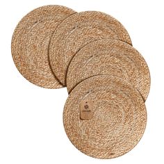 four round placemats made out of jute