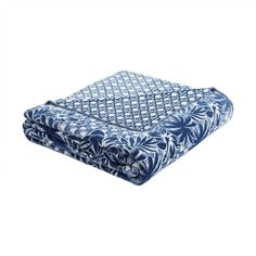 a blue and white blanket on a white background