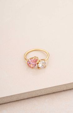 A mixed duo of cubic zirconia shimmers brilliantly atop this slender ring band plated in 18-karat gold. Cubic zirconia/18k-gold plate Imported Pink Gemstone Rings, Colorful Promise Rings, Couple Birthstone Ring, Gold And Pink Ring, Gold Cubic Zirconia Open Birthstone Ring, Gold Cubic Zirconia Birthstone Ring, Open Design, Gold Cubic Zirconia Open Ring Birthstone, Gold Open Ring With Cubic Zirconia Birthstone, Rose Gold Cubic Zirconia Birthstone Ring