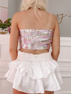 Meet the Be My Bow Sequin Top from Sassy Shortcake! This strapless top features silver multicolored sequins, a big front bow, and a back zipper. Lined. fit: true to size, model wearing a size small content: 100% polyester care: hand wash cold Sequin Bandeau Top For Summer, Summer Sequined Bandeau Tops, Chic Summer Tube Top With Sequins, Chic Summer Sequin Tube Top, Chic Sequined Summer Tube Top, Spring Sequined Tube Top, Strapless Sequin Tube Top For Summer, Glamorous Sequined Tube Top For Summer, Glamorous Sequined Summer Tube Top