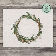 a white napkin with a wreath on it