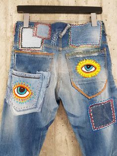 "Ready to send:Size 34 ,33,32,31 Unique vintage jeans with apcycled patches. One of a kind.. Hand made embroidery and unique painting .... ---Or---- Made to order, in any size, within 12 working days . If you need different size, please send me a message and I will make you a special and unique design within 12 working days. They are all different! No one will have the same one as you have! Hand painted, one of kind jeans. You pick your size, model (slime- boyfriend- high waist- low waist) and p Multicolor Denim Pants With Pockets, Multicolor Jeans With Pockets, Multicolor Straight Leg Denim Pants, Blue Straight Leg Festival Bottoms, Vintage Straight Leg Patchwork Bottoms, Vintage Patchwork Straight Leg Bottoms, Festival Straight Leg Jeans With Pockets, Festival Straight Leg Jeans, Blue Retro Pants With Five Pockets