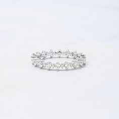 Sweet, simple, and dainty alternating CZ eternity band. Perfect for a minimalist look, or for stacking Made of 925 Sterling Silver We use a THICK, DURABLE 14k Gold or Rhodium plating - for a piece that will last you years to come! VERY HIGH QUALITY Available in sizes 4, 5, 6, 7, 8, 9, or 10 Features alternating sized stones throughout the entire ring Stone sizes: 1.5mm & 5mm Nickel-Free & Hypoallergenic We use the highest grade cubic zirconia stones for an authentic diamond look! Eternity Ring Gold, Ring Stone, Ring Sizer, Ring Size Guide, Eternity Band, Eternity Bands, Eternity Ring, Timeless Pieces, Precious Metals