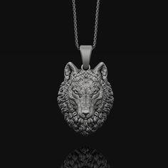 "Embrace the power and mystique of the wolf with this captivating 3D silver necklace. Designed with intricate details, this extraordinary piece embodies the strength, intelligence, and beauty of the wild wolf. The wolf head design is both symbolic and stylish, making it a perfect accessory for the free-spirited and nature lovers alike. This unisex necklace is the perfect gift for those who feel a deep connection to the wolf as their spirit guide or simply appreciate the allure of these majestic Silver Wolf Pendant Necklace, Silver Wolf Design Round Pendant Necklace, Silver Necklace With Wolf Design Round Pendant, Silver Round Pendant Necklace With Wolf Design, Silver Wolf Design Pendant Necklace, Wolf Head Design, Totem Necklace, Wolf Totem, Wolf Pendant