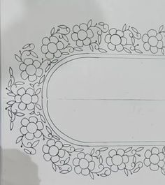 a drawing of flowers and leaves on a sheet of paper