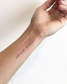 a person's arm with a small tattoo on it that says, you are beautiful