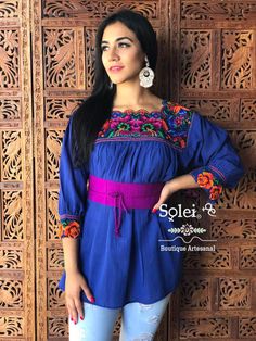 This Beautiful Mexican blouse is embroidered by Cross Stitch and has colorful florals embroidered around the collar. Please note: This blouse comes in one size which fits sizes Small, Medium and Large. You have the option of purchasing the blouse with the belt for a special price or the blouse on its own. The Jewelry modeled may be purchased separately in another post. Multicolor Bohemian Embroidered Long Sleeve Top, Bohemian Multicolor Embroidered Long Sleeve Top, Multicolor Long Sleeve Bohemian Embroidered Top, Embroidered Bohemian Purple Blouse, Multicolor Bohemian Tunic Peasant Top, Multicolor Peasant Top For Festival, Bohemian Embroidered Purple Blouse, Bohemian Multicolor Peasant Tunic Top, Multicolor Bohemian Embroidered Top With Border