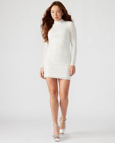 Elevate your style with our KRISTA dress. This long-sleeved mini dress features a mock neck and back zipper closure. This stunning dress also features unique square-shaped rhinestone stud embellishments for a touch of glamour. Make a statement with this elegant and sophisticated piece, perfect for any occasion. Long-sleeved bodycon mini dress Square-shaped rhinestone embellishments Back-zipper closure Length: 33.5" 87% polyester 13% elastane Hand wash Evonique is 5ft 10 in and is wearing a size Rhinestone Mini Dress, Rhinestone Mini Dresses, Rhinestone Embellishments, Rhinestone Studs, Long Sleeve Bodycon, Long Sleeve Mini, Long Sleeve Mini Dress, Bodycon Mini Dress, Stunning Dresses