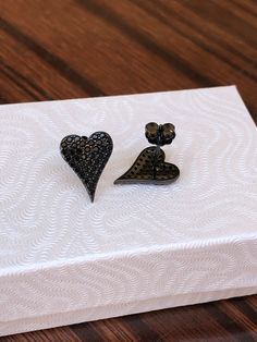 925 Sterling Silver Pave Black Onyx Heart Stud Earrings   - Metal: 925 Sterling Silver (Finish: Rhodium Plated) - Stone: Lab-Created Black Onyx, Round, Pave - Shape: Heart - Dimension:  12.5mm(0.49 in) x 9.5mm(0.37 in), Thickness 1mm (Please note that 12.5mm/0.49" is measured from point to point. Because of slim pointed shape, the actual earrings look Smaller.) - Closure: Post at Upper Top, Push Back - Color: Black Black Earrings For Valentine's Day, Black Heart Earrings As A Gift, Black Heart Earrings For Pierced Ears As Gift, Black Sterling Silver Double Heart Jewelry, Black Sterling Silver Jewelry For Valentine's Day, Black Heart-shaped Earrings For Gift, Black Double Heart Jewelry Gift, Black Heart Charm Earrings For Valentine's Day, Black Heart-shaped Jewelry For Anniversary