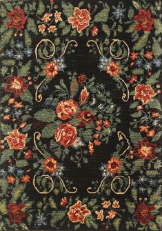 an area rug with flowers and vines on black ground, in the middle of it