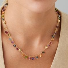 Available to Order (Orders Placed Today Will Ship in 4-6 Weeks) This exquisite necklace boasts a mix of colored gemstones and 18K yellow gold beads, finely hand-engraved with the ancient Florentine technique. With its intense hues and sophisticated design, this necklace adds the perfect pop of color to any outfit. 18K Yellow Gold Africa Gemstones Multi-Colored Gemstones 16.5 Inches Luxury Multicolor Necklace With Gemstone Accents, Luxury Multicolor Necklaces With Gemstone Accents, Luxury Multicolor Gemstone Necklaces, Yellow Gold Multi-stone Fusion Gemstones, Fusion Style Multi-stone Yellow Gold Gemstones, Luxury Multicolor Briolette Necklaces, Luxury Multicolor Briolette Necklace, Luxury Multicolor Briolette Jewelry, Exquisite Gold Gemstones With Accents