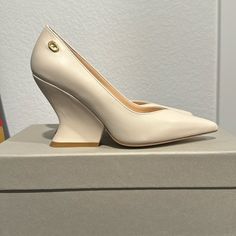 Dee Ocleppo Nappa Leather Ivory Wedge Pumps, Size 6, New, Never Worn, Leather Upper, Interior And Sole, 3,5” Wedge Heel, Made In Italy, Fits True To Size, Pointed Toe But Not Narrow, Comfortable, Box And Dust Bag Included. Beige Calf Leather Heels With Removable Insole, Cream High Heel Calf Leather Heels, Cream Calf Leather High Heels, Chic Leather Wedge Heels, Luxury Cream Platform Heels, Luxury Cream Calf Leather Heels, Luxury 4-inch Wedge Heels, Luxury Low Heel Cream Heels, Luxury Cream Block Heel Shoes