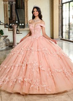 Look like a fairy-tale Princess in this 3D floral applique long off shoulder dress with A-line skirt by Rachel Allan RQ1134. Look no further than the glitter tulle Quinceanera gown, perfect for your big day! This dress is designed with intricate details that show off your unique personality and style. From the delicate 3D flowers that capture the sparkle in the day, to the exquisite applique and beading that adorns the top of the dress, this gown is sure to make a statement. Let's not forget the Peach Quinceanera Dresses, Black Ball Gown, Red Quinceanera Dresses, Plus Size Cocktail Dresses, Plus Size Party Dresses, Dress Guide, Sweet 16 Dresses, Quince Dresses, Ball Gown Dresses