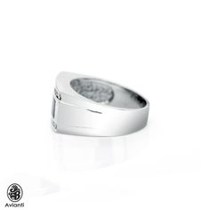 Although simple, this ring brings forth a truly masculine character. This extraordinary Onyx ring is sleek, smooth finished, in 14 karat white gold. It has a rectangular onyx horizontally set in a bezel. The diamonds are channel set. [MATERIALS] Center Stone: Onyx(2) Stones: Diamonds(16) Cut: Round Carat: 0.66 Clarity: SI1 Color: G-H Measurement of the ring: 11.85 mm Metal: 11.30 Grams of 14 karat White Gold [ORDERS] All items that are made to order take about 7-12 days to create and to ship. [A Modern Formal Rings With Polished Edges, Modern Silver Sapphire Ring For Formal Occasions, Modern Engraved Ring With Polished Finish For Formal Occasions, Minimalist Sapphire Ring With Polished Finish For Formal Events, Formal Open Ring With Polished Edges, Classic Formal Signet Ring With Channel Set, Minimalist Channel Set Rings For Formal Occasions, Formal Minimalist Channel Set Ring, Classic Formal Signet Ring Channel Set