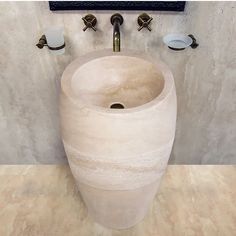 a bathroom with a sink and soap dispenser