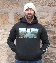 "Organic cotton and recycled polyester unisex hoodie featuring the stunning road to Glencoe in the Scottish Highlands. PETA approved vegan & Fair Wear Certified, printed with vegan, water based ink. Features:  2 x pockets!  Soft fleecy lining Luxurious double layered hood. Round drawcords in matching body colour with metal tipping and eyelets. Colour: dark heather grey Launched in 2021, Falling Leaf Clothing is an online retailer of affordable, environmentally and socially conscious clothing wit Leaf Clothing, Stirling Scotland, Falling Leaf, Romantic Road, Cotton Beanie, Kangaroo Pouch, Stirling, Scottish Highlands, Guilt Free