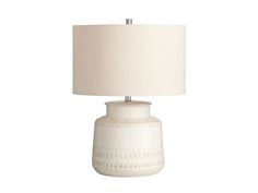 a white table lamp with a cream shade on it's base and a light bulb in the middle