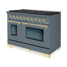 a gray stove with two ovens on it's sides and gold trim around the burners