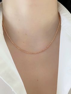 "Shiny And Bright Dainty 14K Rose Gold Beaded Ball Solid Chain. Perfectly Worn Alone Or Layered. Necklace Is Perfect For Any Occasion. A Beautiful Gift She Will Treasure Forever! Jewelry Comes In A Cute Jewelry Box Ready To Present. Model Is Wearing 16\" Chain -All Jewelry Is New And Inspected For Quality Assurance. -Jewelry Is Crafted In Genuine High Quality 14K Gold. -We Do Not Sell Gold Plated Or Gold Filled. Product Detail: Metal: 14k rose gold Weight: 16\" inch 5.2 grams Width: 2mm Closure: Rose Gold Single Strand Necklace As Gift, Rose Gold Single Strand Necklace For Gift, Rose Gold Beaded Chain Necklace For Gift, Delicate Single Strand Rose Gold Necklace, Rose Gold Necklaces With Round Tiny Beads, Rose Gold Ball Chain Necklace As Gift, Rose Gold Ball Chain Necklace Gift, Rose Gold Single Strand Necklace With Round Beads, Dainty Rose Gold Beaded Necklace With Round Beads