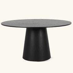 a round table with black legs and an oval top, on a white background the table is made out of wood