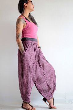 "Beautiful soft cotton fabric. Made into our popular dropcrotch capris pants but this one the crotch is not as low! 2 pieces of leg patch together in an untraditional way. We play around with the pattern and it turns out good! Simple elastic waist. cuff leg.2 super useful pocket on both sides. Very comfortable. Measurement; Waist (elastic) 24-26\" Hip max 36\" Length 33\"" Baggy Capri Pants With Pockets, Summer Baggy Capri Length Pants, Summer Casual Capri-length Harem Pants, Spring Capri Length Harem Pants With Pockets, Spring Capri-length Harem Pants With Pockets, Baggy Harem Pants With Side Pockets For Loungewear, Baggy Harem Pants With Tapered Leg And Hip Pockets, Baggy Harem Pants With Hip Pockets And Tapered Leg, Relaxed Fit Harem Pants With Side Pockets