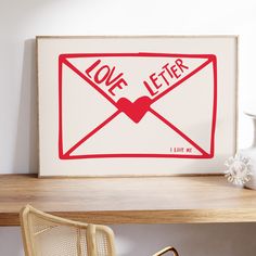 a red and white sign that says love letter on the wall next to a chair